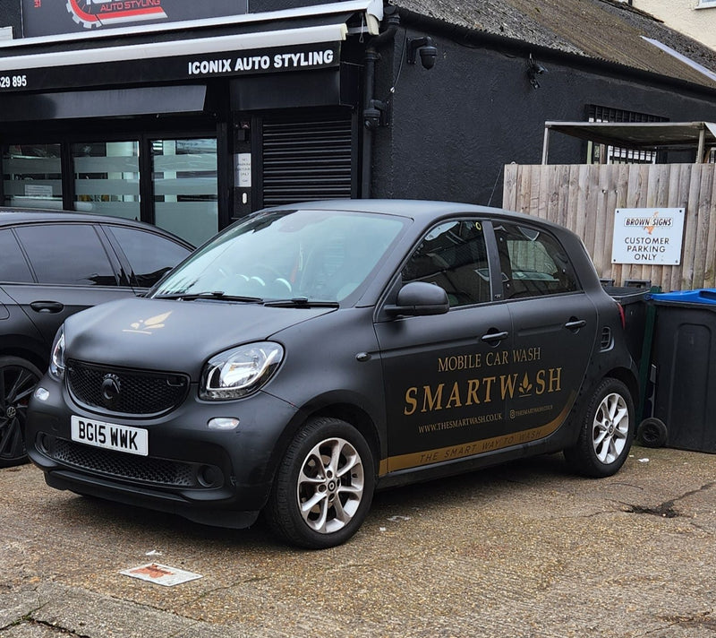SmartWash car parked outside a workshop